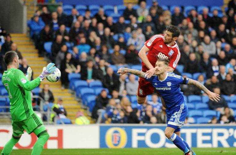 Lukas Jutkiewicz powers home a header against Cardiff City
