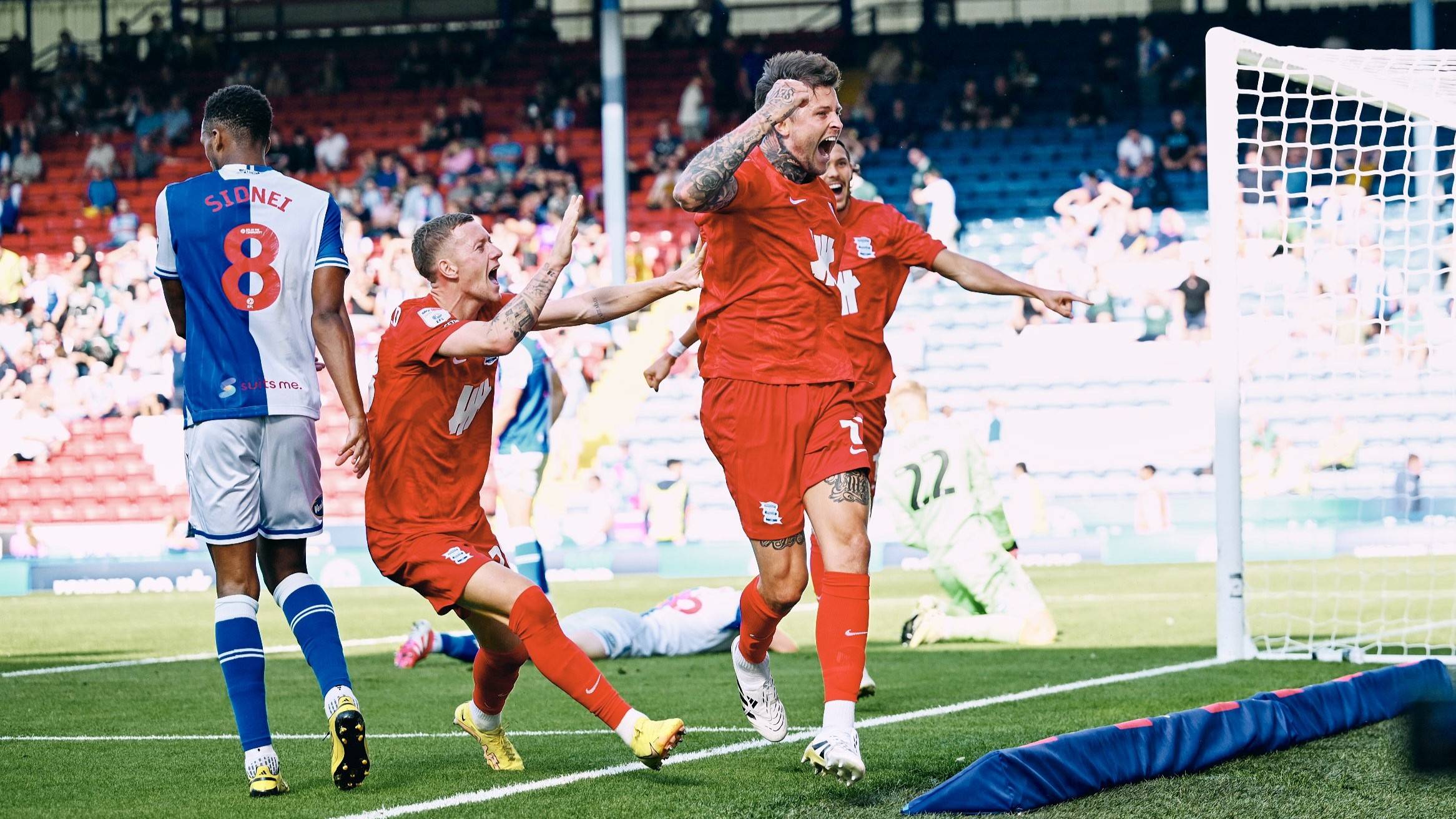 Lyndon Dykes and Jay Stansfield celebrate in front of 7,000 Blues fans at Blackburn Rovers