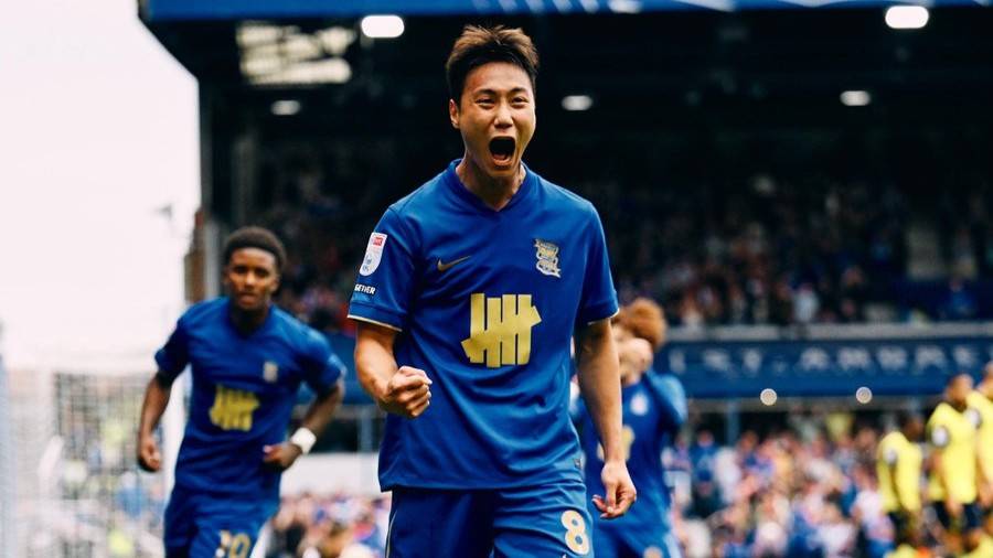 Paik Seung-ho celebrates his goal against Oxford United