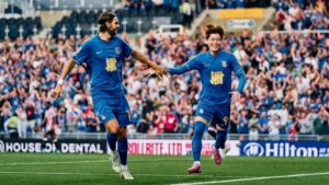 Willum Willumsson and Paik Seung-ho celebrate Paik's goa against Oxford United